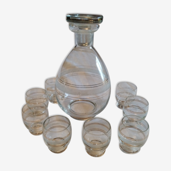 Glass carafe and its 8 shot glasses vintage