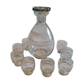 Glass carafe and its 8 shot glasses vintage