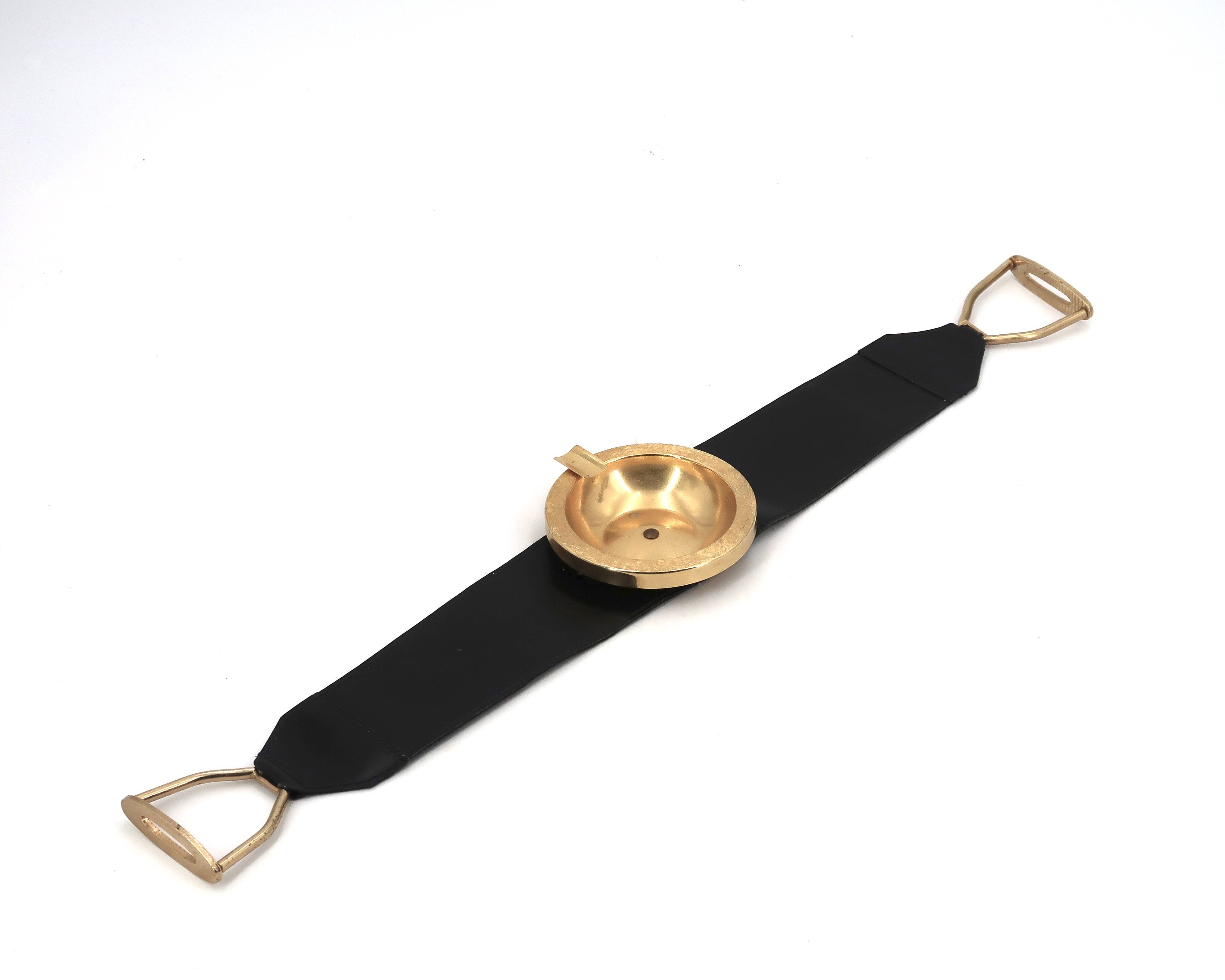 Golden metal armrest ashtray with faux leather and stirrups, 1950s.