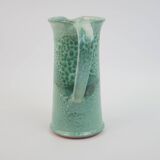 Large green ceramic pitcher with leopard enamel