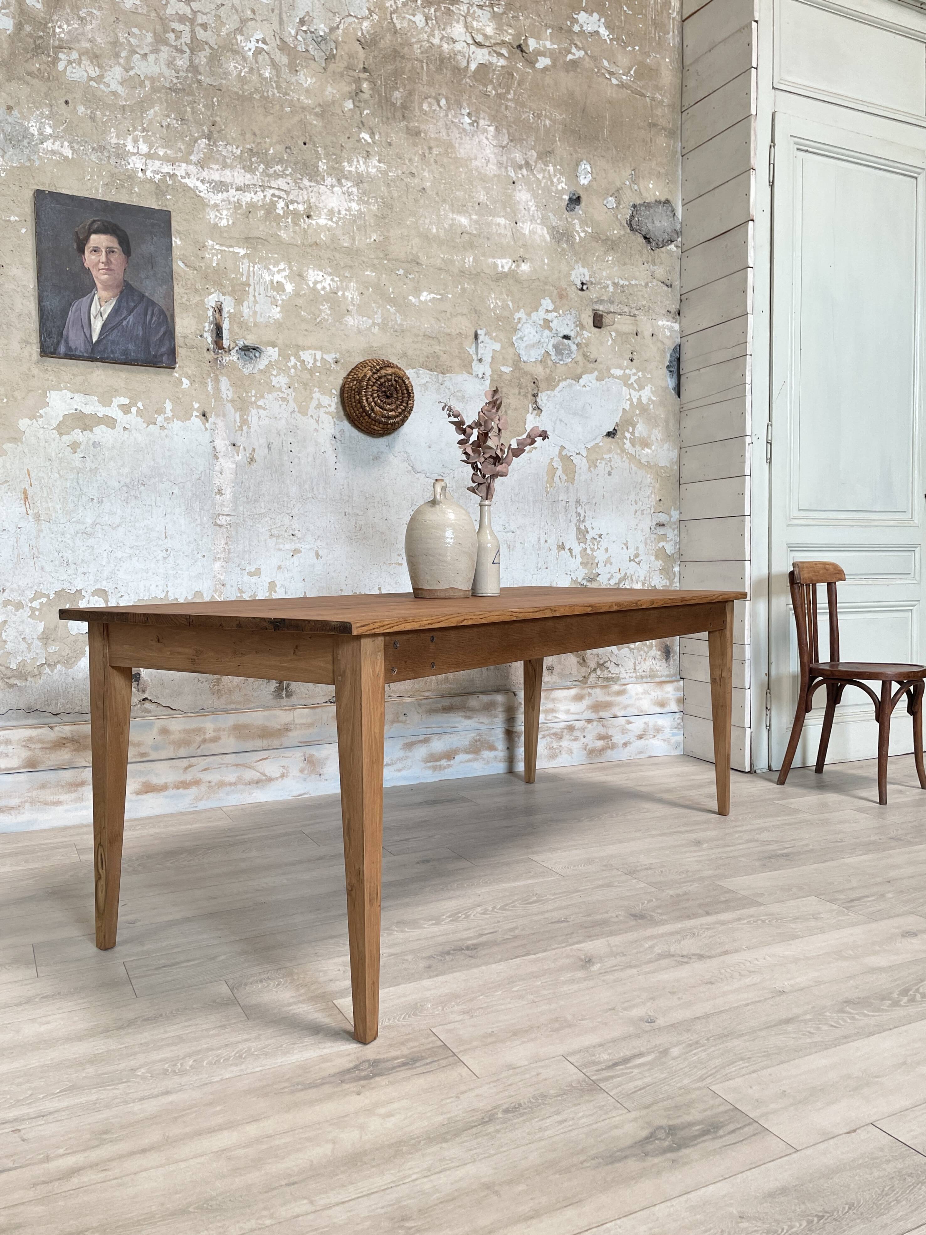 Vintage farm table with spindle legs.