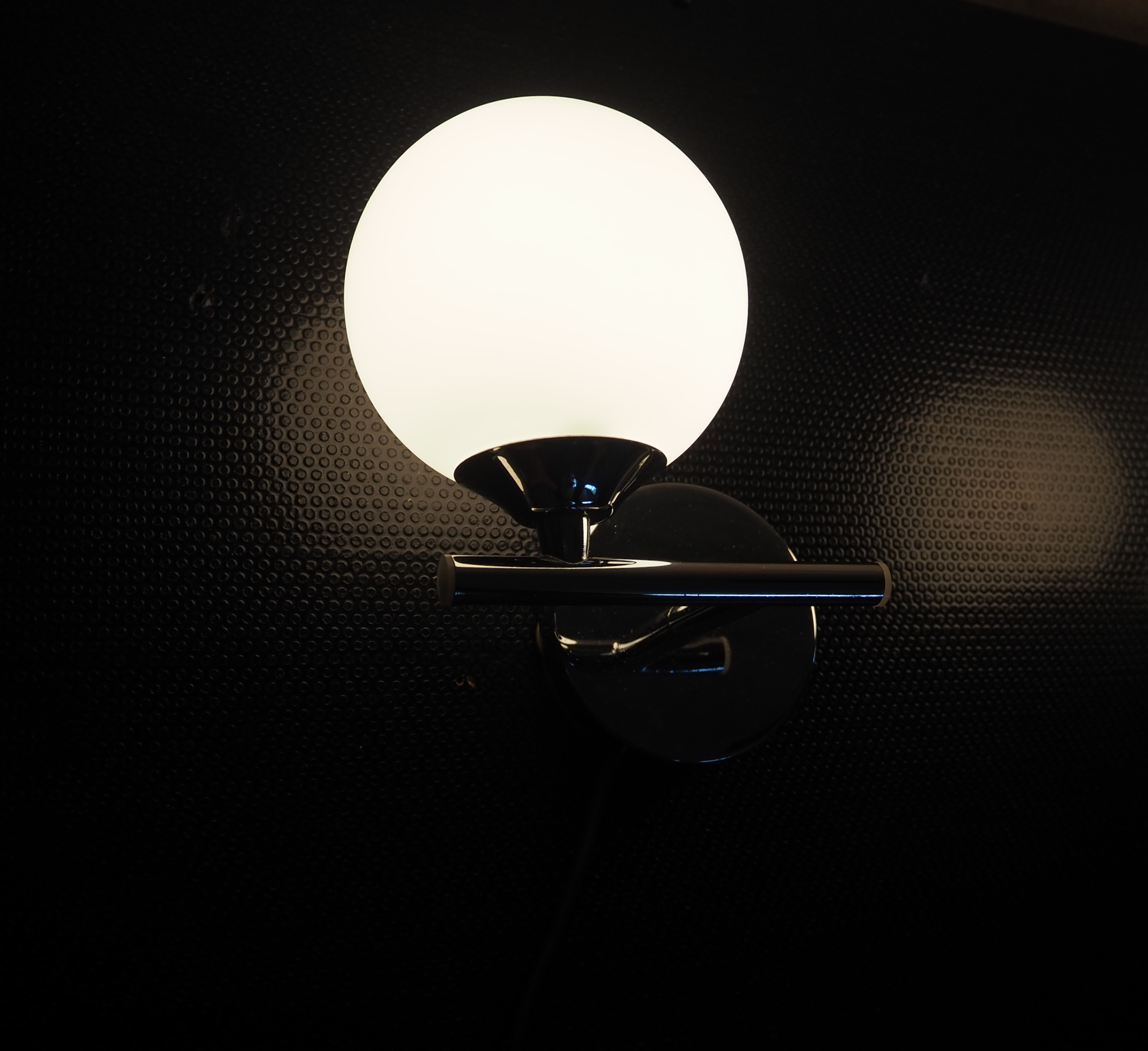 Pair of sconces with an opaline globe and chrome structure from the 1970s