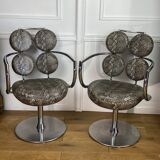 Pair of italian swivel armchairs in chrome-plated metal and piton imitation fabrics