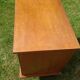 Rattan and wood splayed-leg chest of drawers
