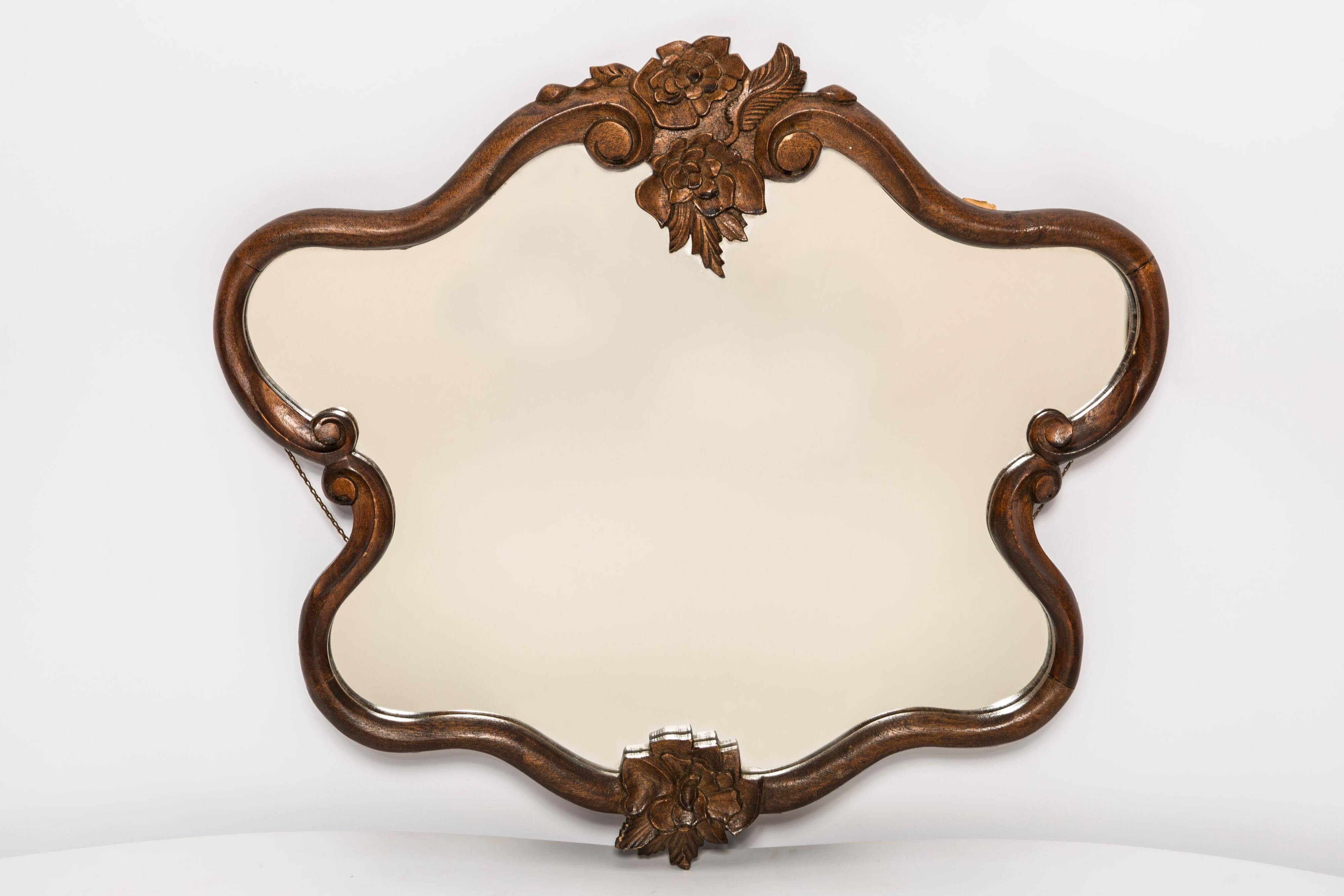 Medium vintage mirror in dark brown wood, Europe, 1960.