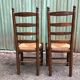 Duo of vintage rustic straw straw chairs in oak.