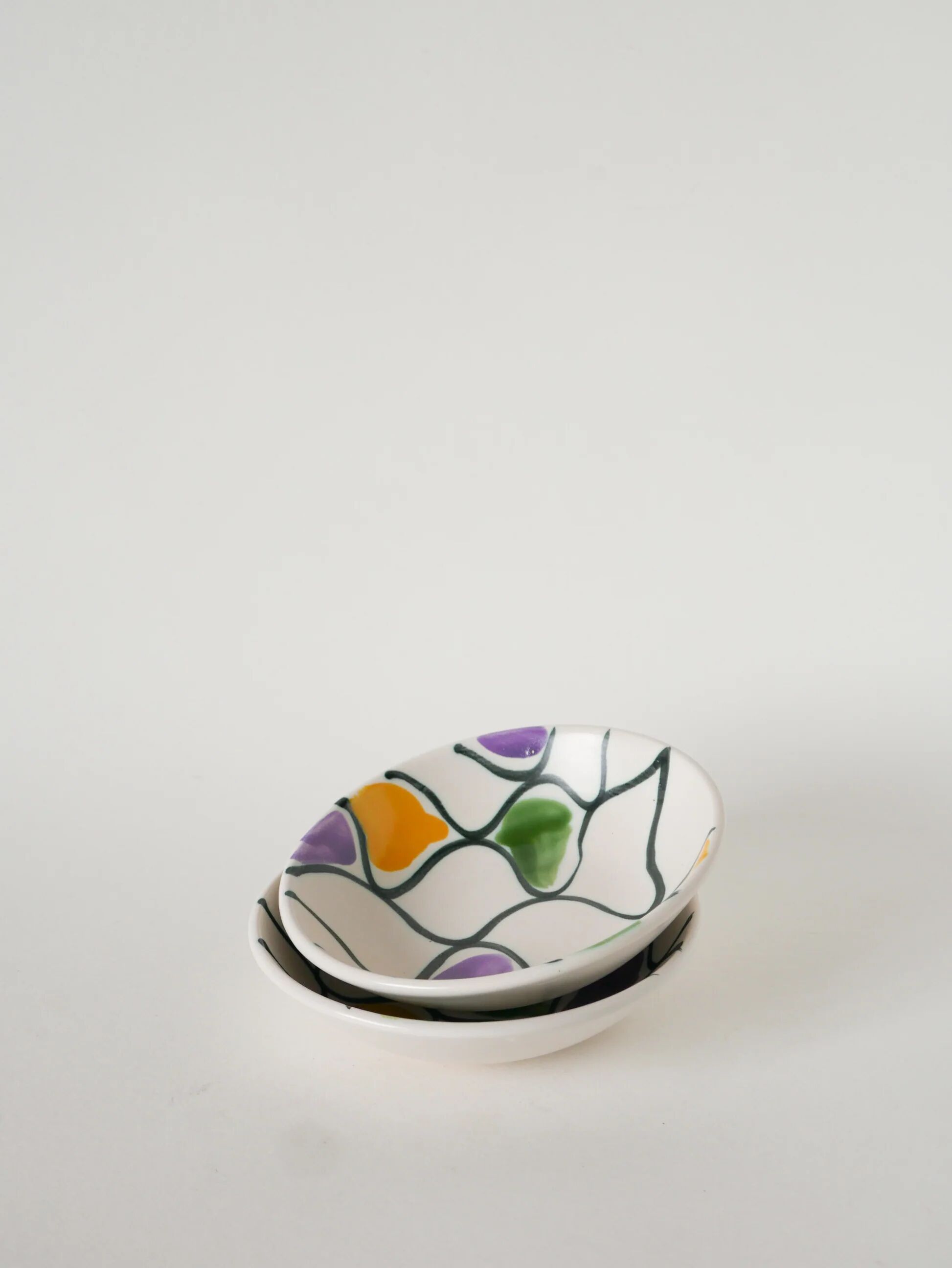 Pair of ceramic ramekins, abstract patterns in yellow, purple, and green, Pornic model, 1960.