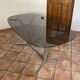Oval table. 1970. Steel and smoked glass. 180x100