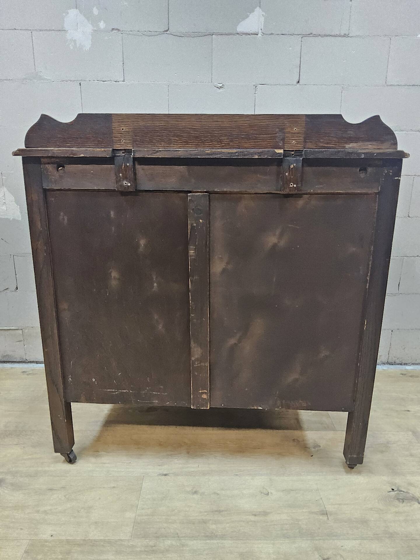 Antique chest of drawers on wheels with wood carving (key top drawer)