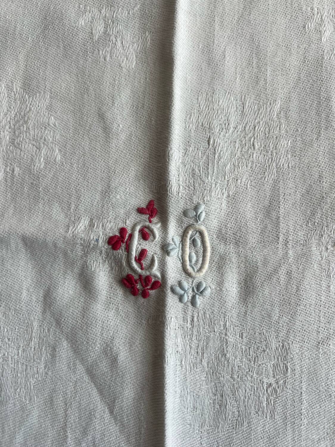 Old cotton tablecloth with flowers and fringes