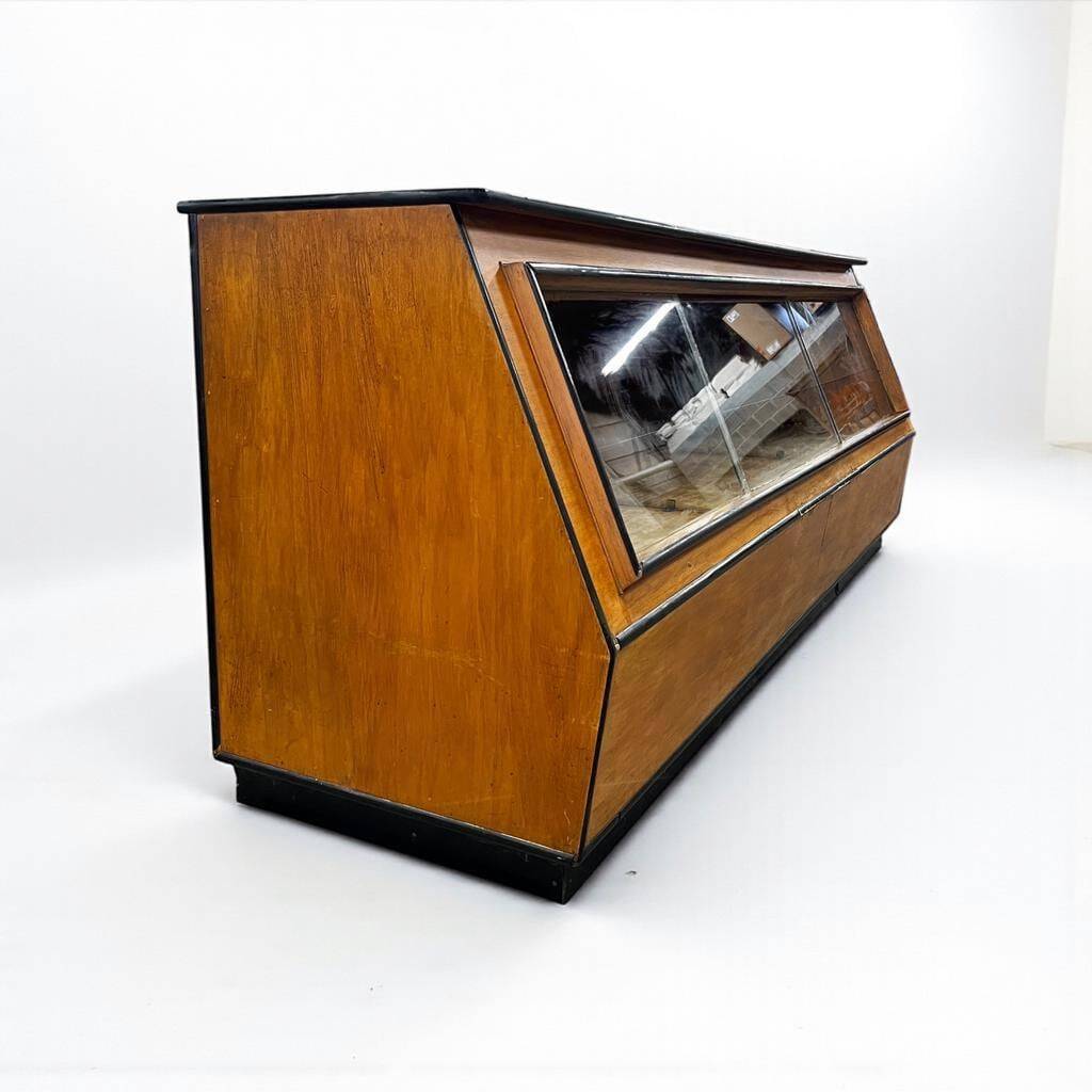 Vintage wooden shop counter with display case