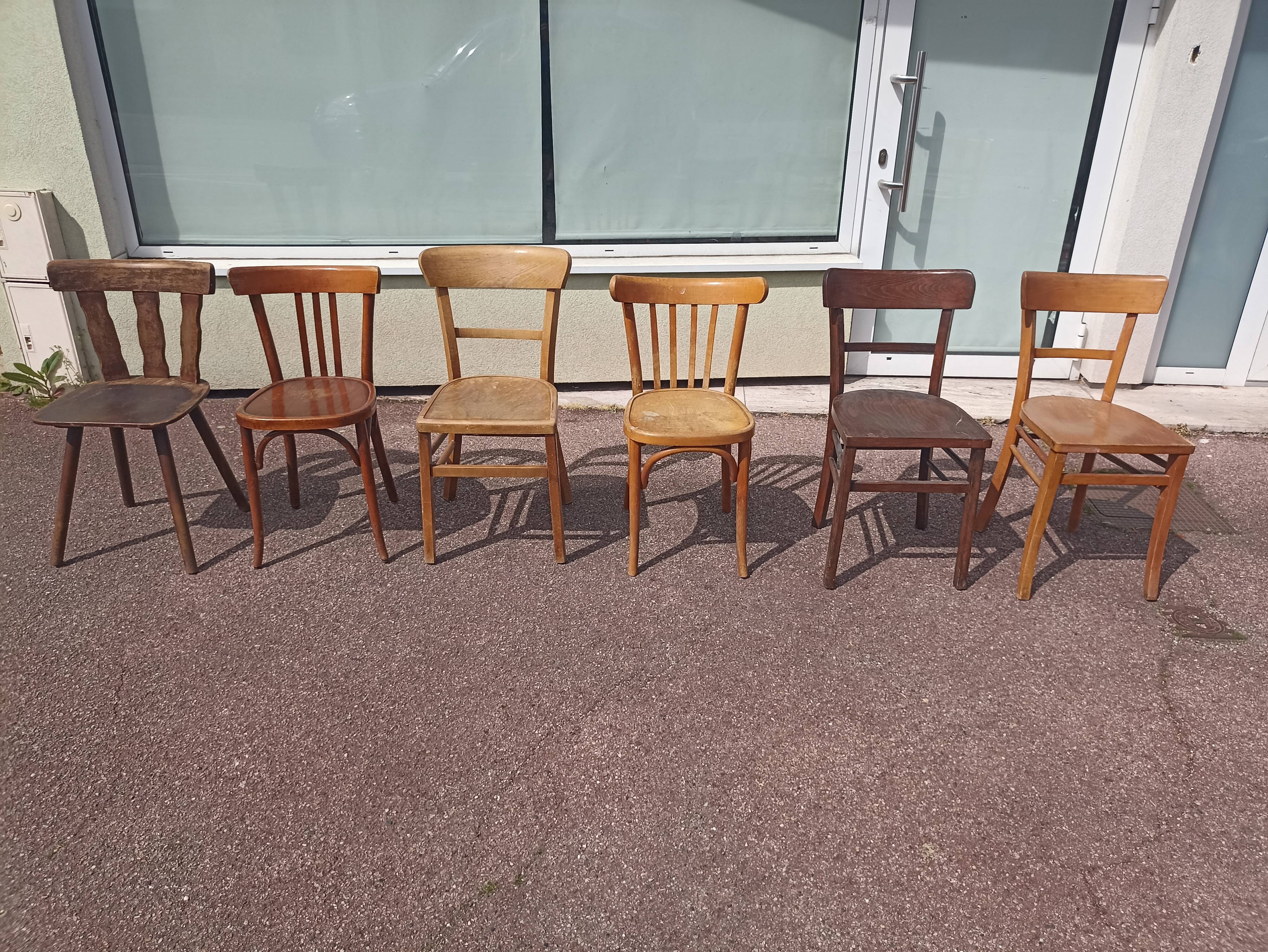 Set of 12 mismatched wooden bistro chairs