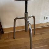 Chrome screw stool of hairdresser workshop