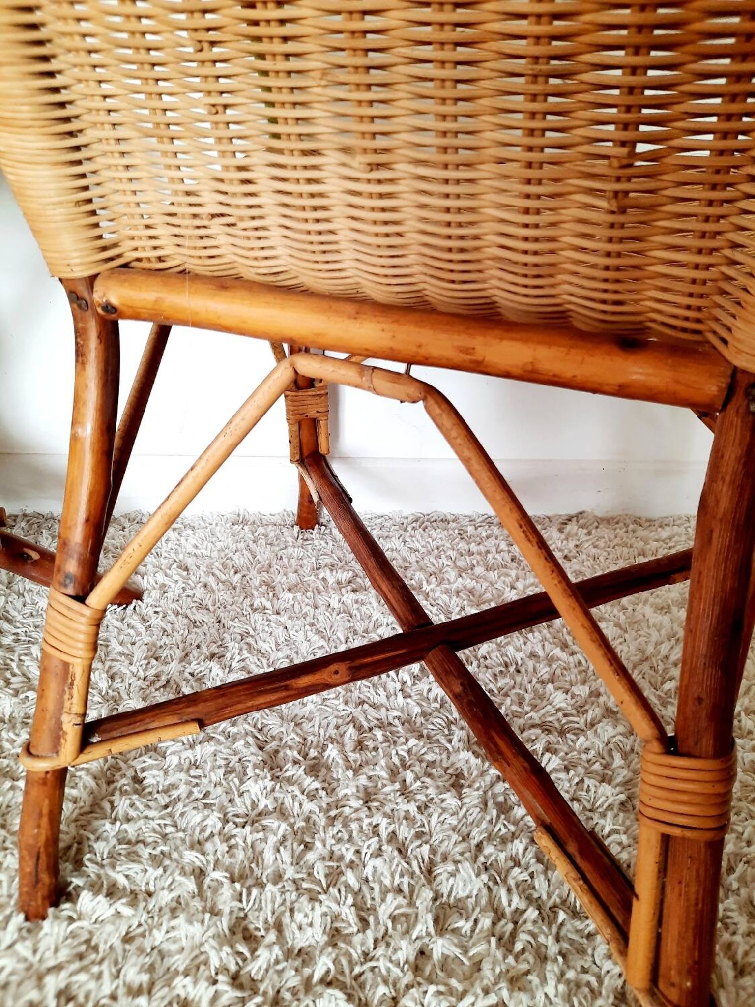 1950s 60s rattan armchair with green apple and black piping.