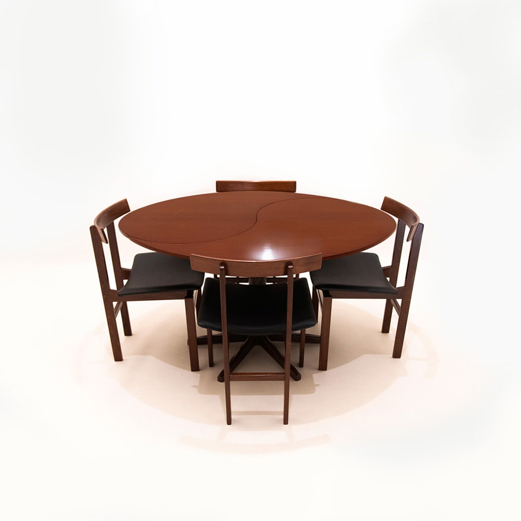 Danish Mid Century Yin-Yang teak extending dining table by Ole Gjerløv-Knudsen and Torben Lind