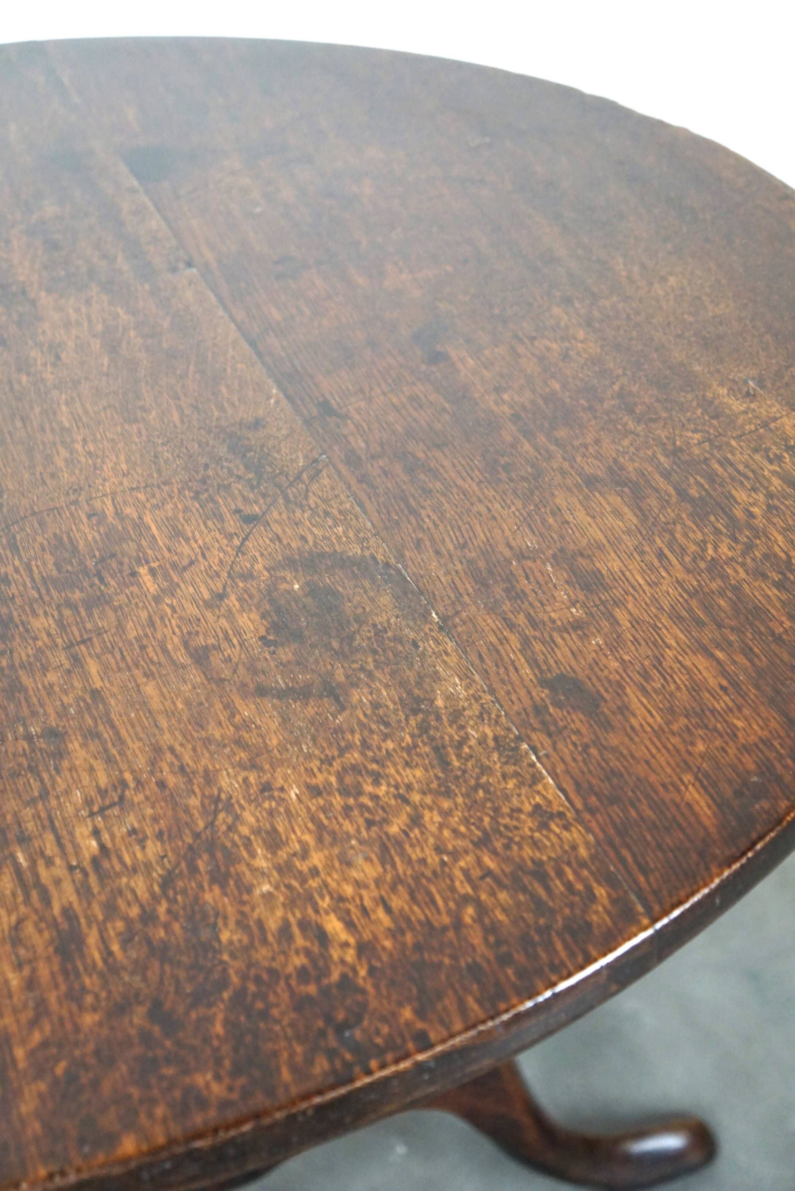 Round antique English oak tilt-top table with wonderful colors