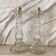 Paire de bougeoirs en verre flacons roger gallet