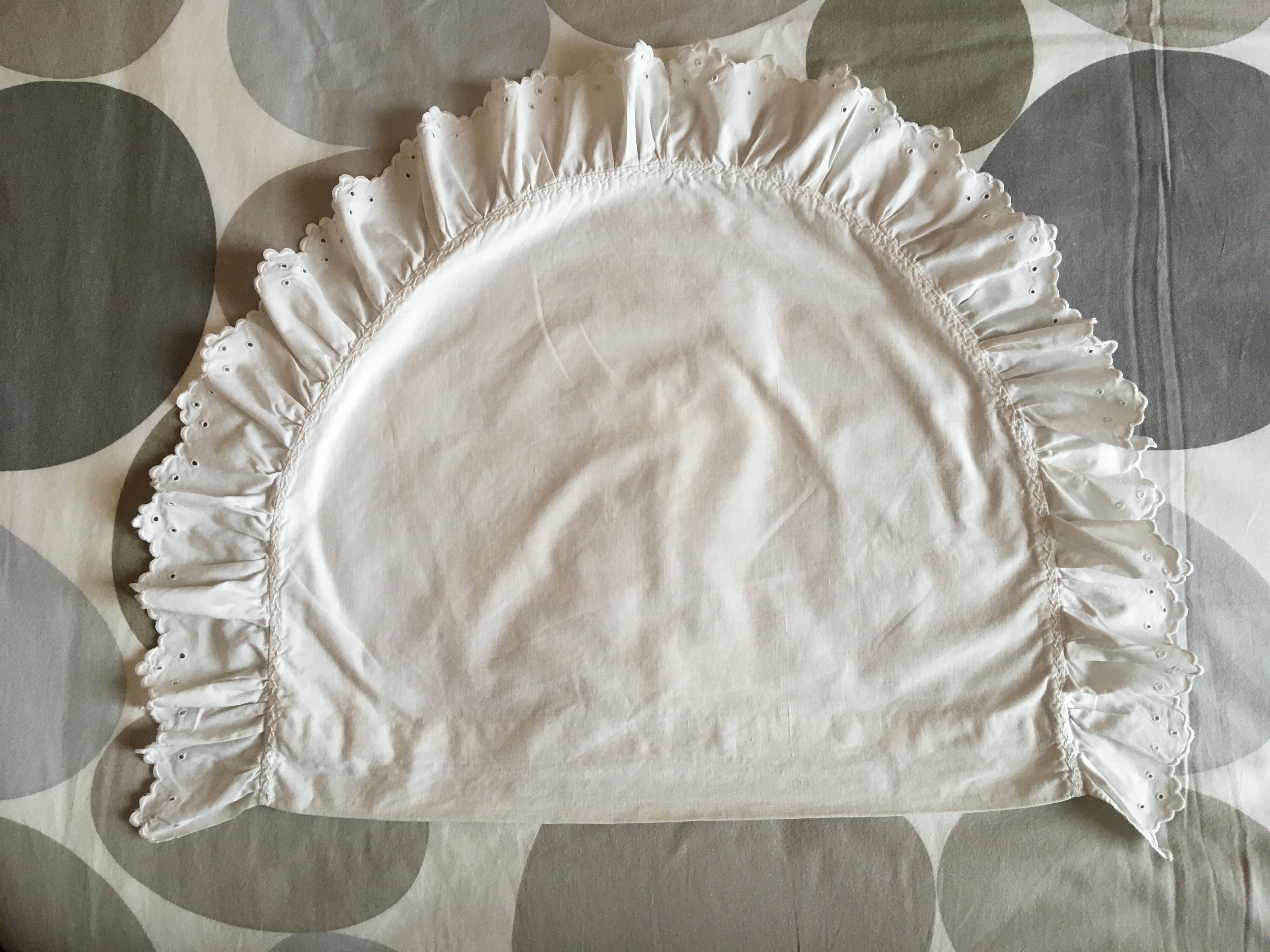 Two half-moon ruffled cushion covers