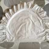 Two half-moon ruffled cushion covers
