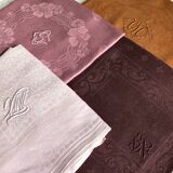 Set of four old damask towels tinted in multiple colors