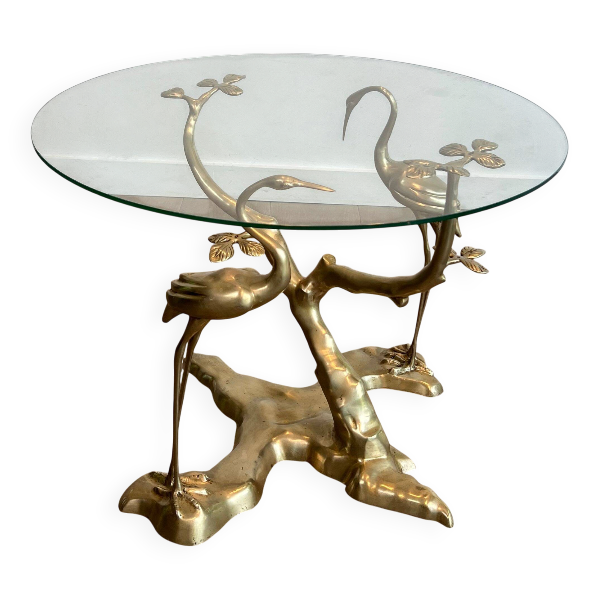 Coffee table model with cranes surrounding a brass bonsai and round glass top by Willy Daro.