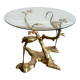 Coffee table model with cranes surrounding a brass bonsai and round glass top by Willy Daro.