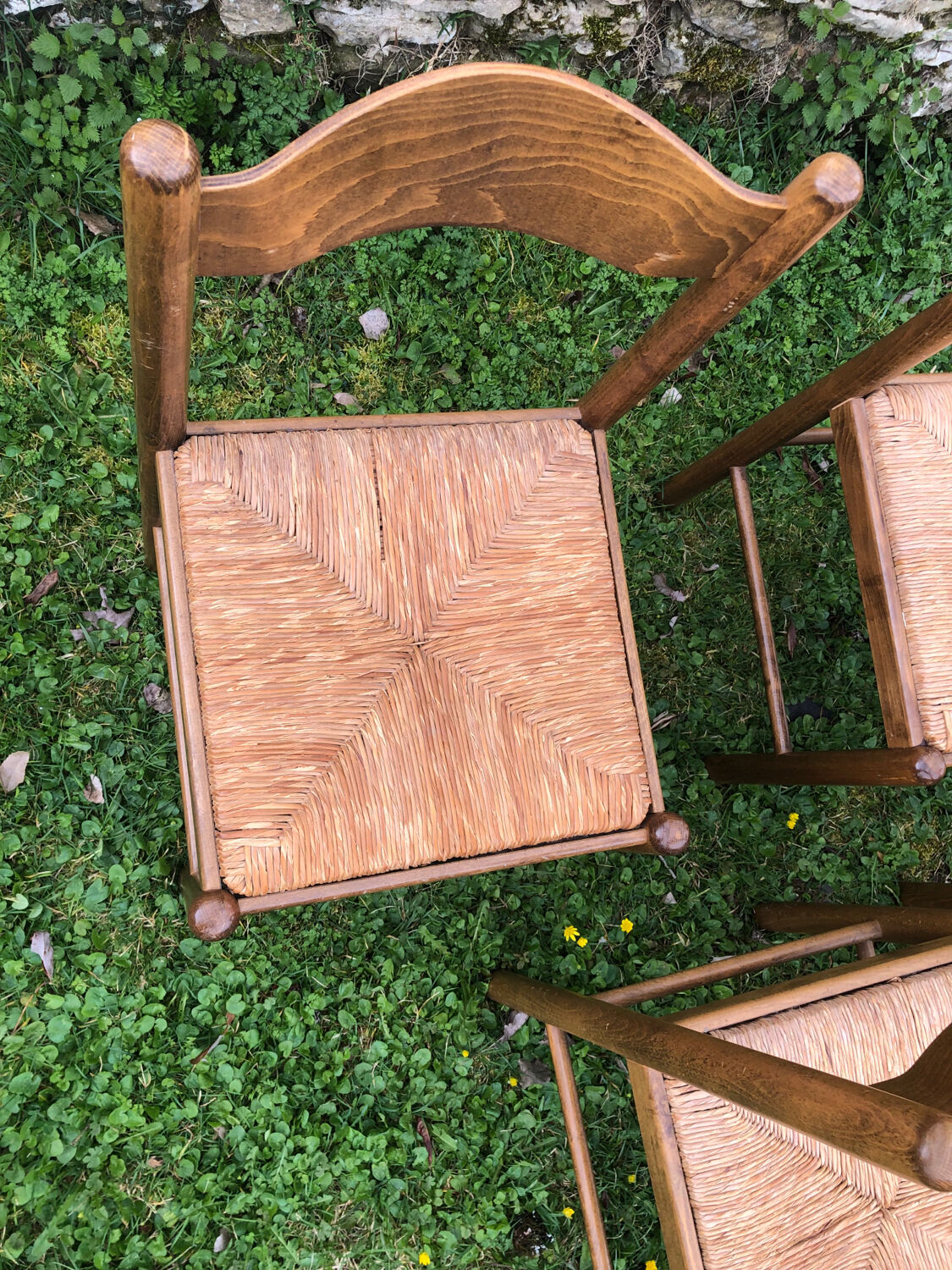 4 wood and straw chairs