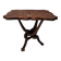 Coffee table with knotted wooden legs in an African pattern