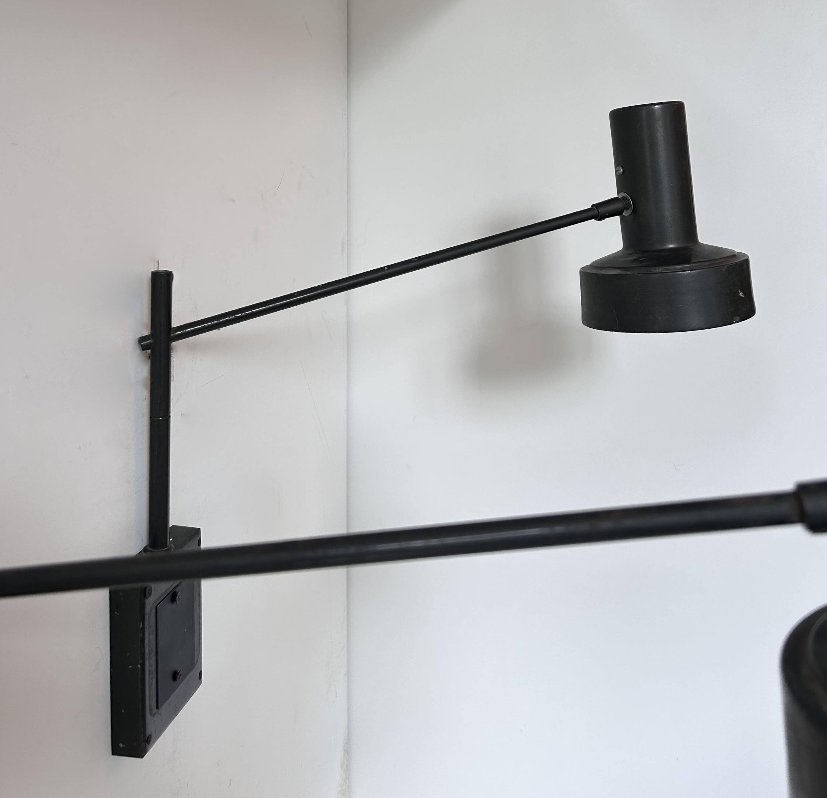 Pair of vintage adjustable wall lights, matte black metal, France 1960s