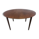 Scandinavian extendable round dining table in teak