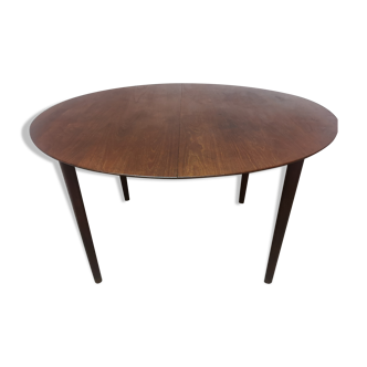 Scandinavian extendable round dining table in teak