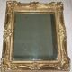 Miroir en bois et stuc redoré de style rocaille 33x29