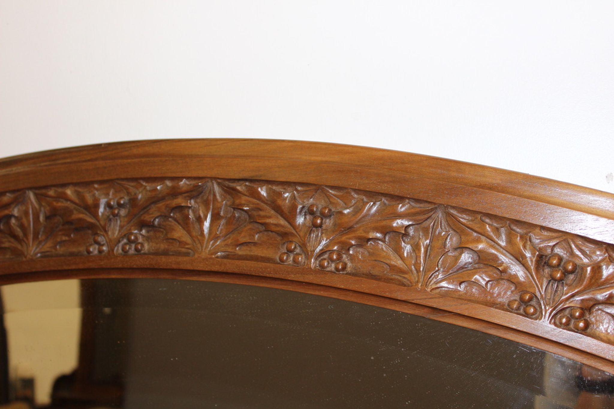 Art Nouveau walnut mirror decorated with holly leaves circa 1900 105x171cm