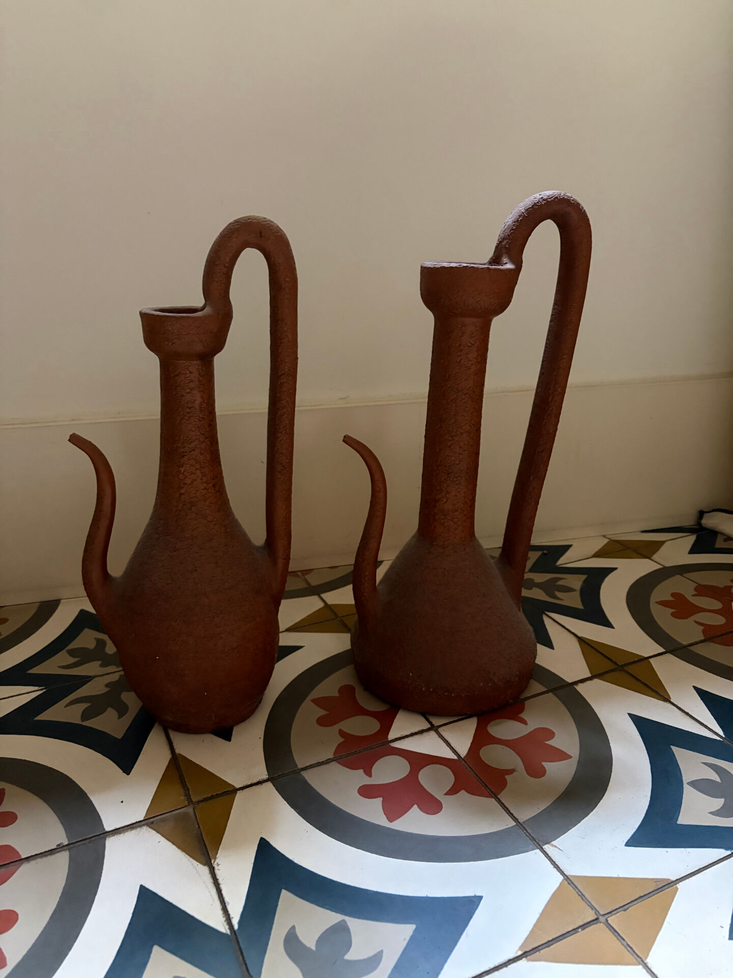 Pair of decorative terracotta jars, in the shape of a ewer.