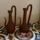Pair of decorative terracotta jars, in the shape of a ewer.
