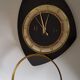Pendule murale formica noire et or marque Trophy Transistor