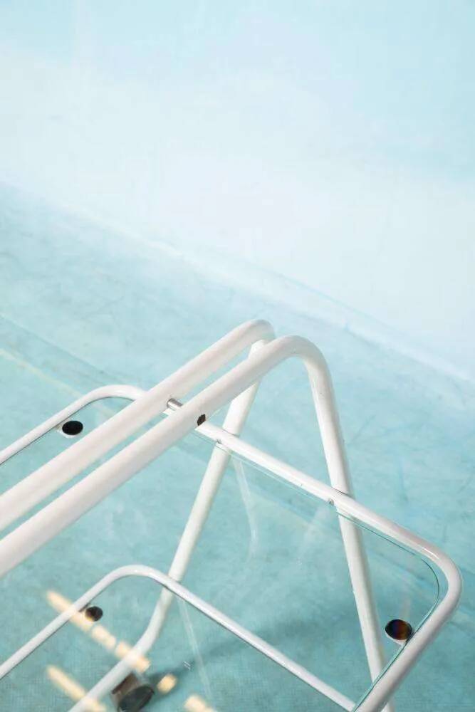 Space age dessert trolley from the 1970s, with metal tubes and glass trays.