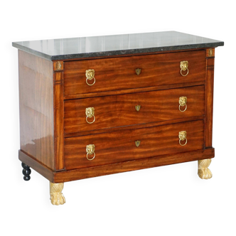 19th-century Empire commode with a marble top and lion paw feet.