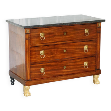 19th-century Empire commode with a marble top and lion paw feet.
