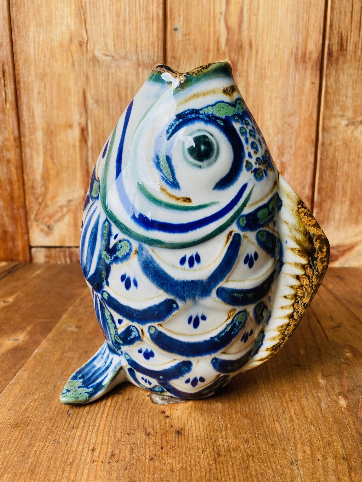 Blue ceramic zoomorphic vase in the shape of a poison.