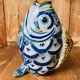 Blue ceramic zoomorphic vase in the shape of a poison.