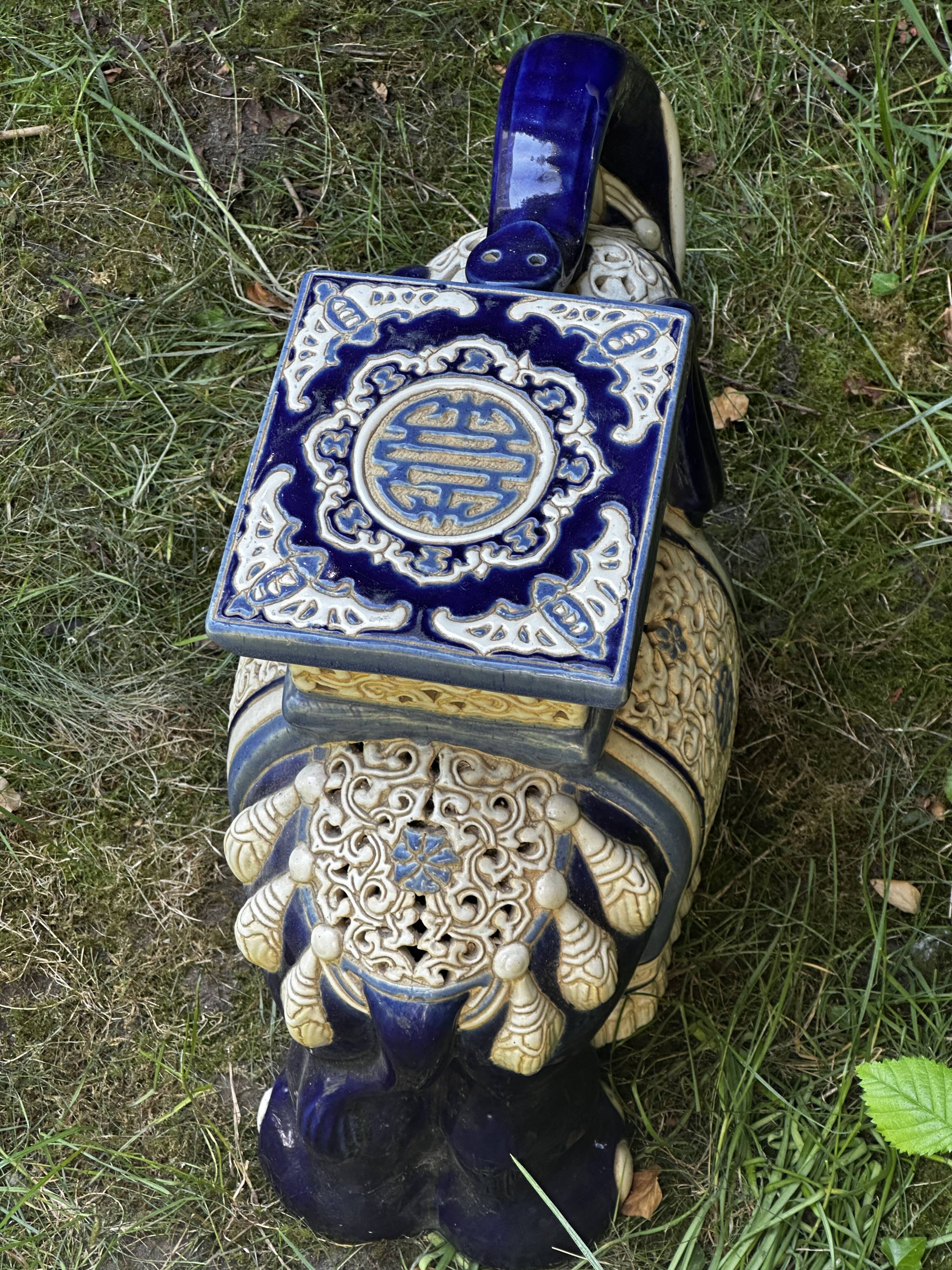 Elephant stool in glazed ceramic in cobalt blue and ivory colors