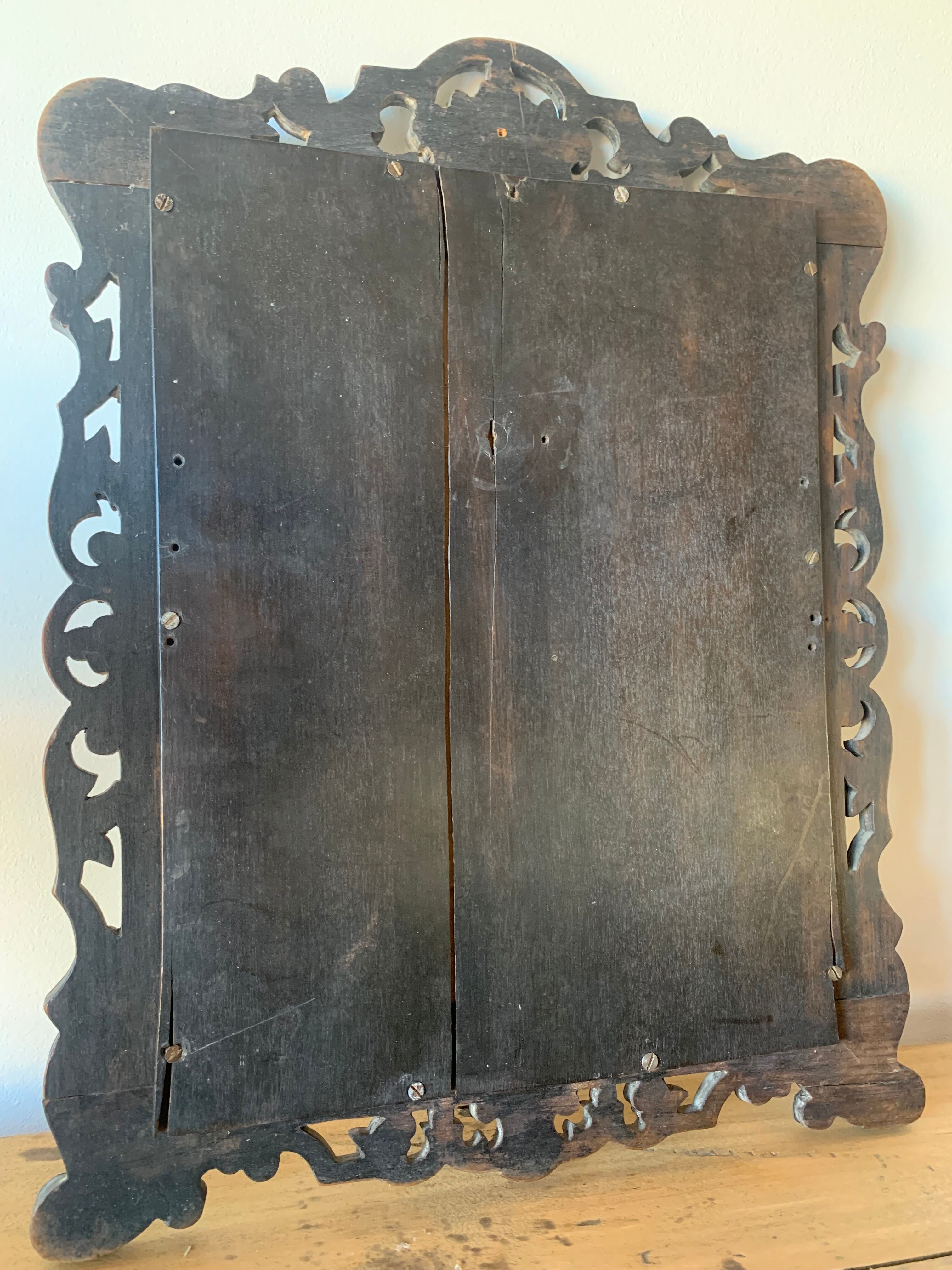 Eventful beveled mirror and openwork period 1900 repelled tin decoration