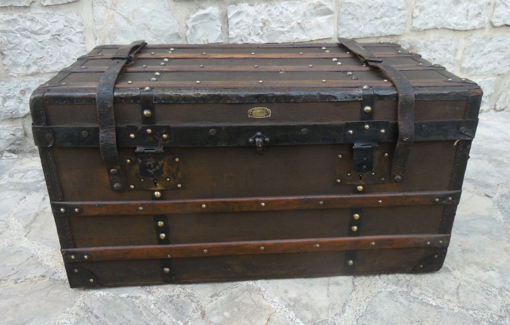 Old wooden and leather trunk, old brass nail trunk and leather strap