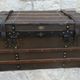 Old wooden and leather trunk, old brass nail trunk and leather strap