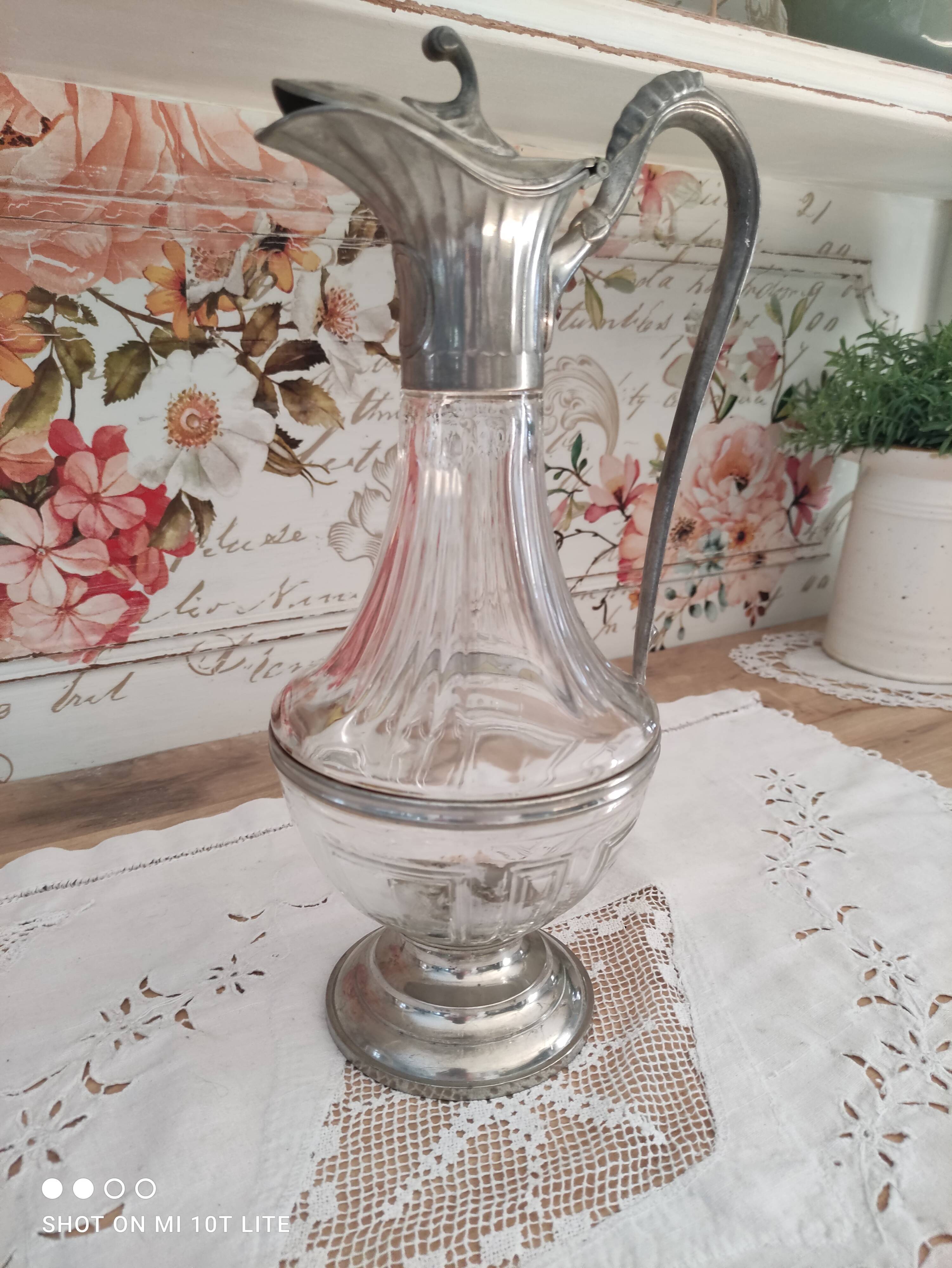 Old water decanter in curved glass and tin Art Nouveau style