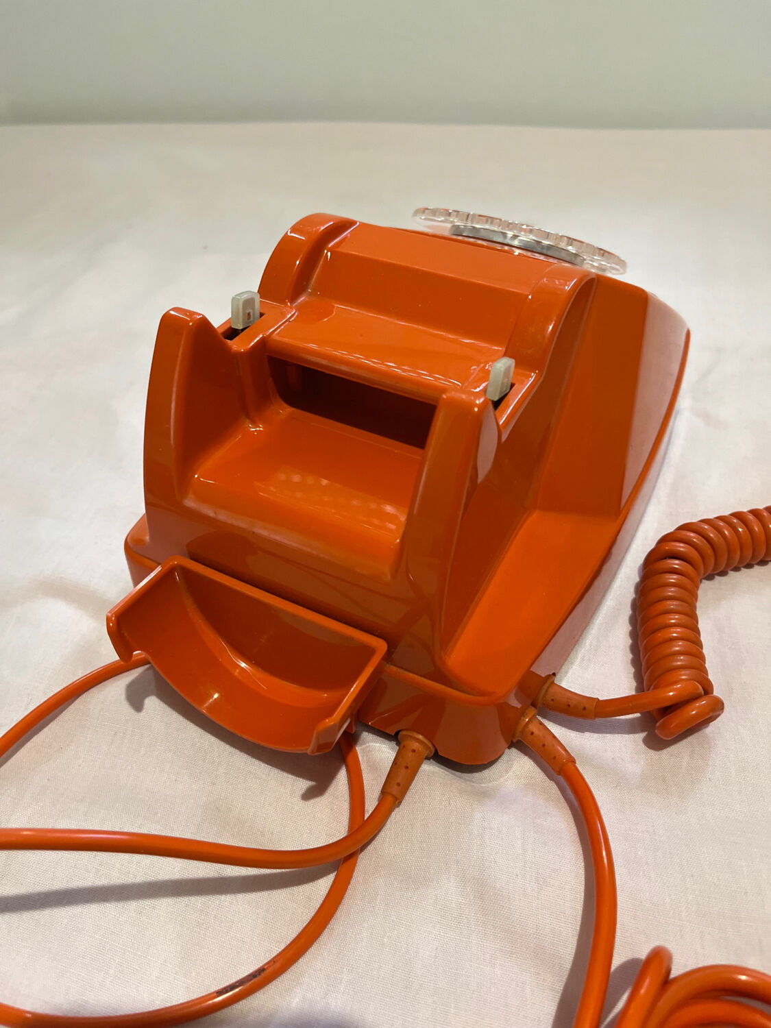 Orange vintage phone with socotel dial