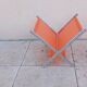 Vintage chrome and orange magazine rack from the 70s and 80s