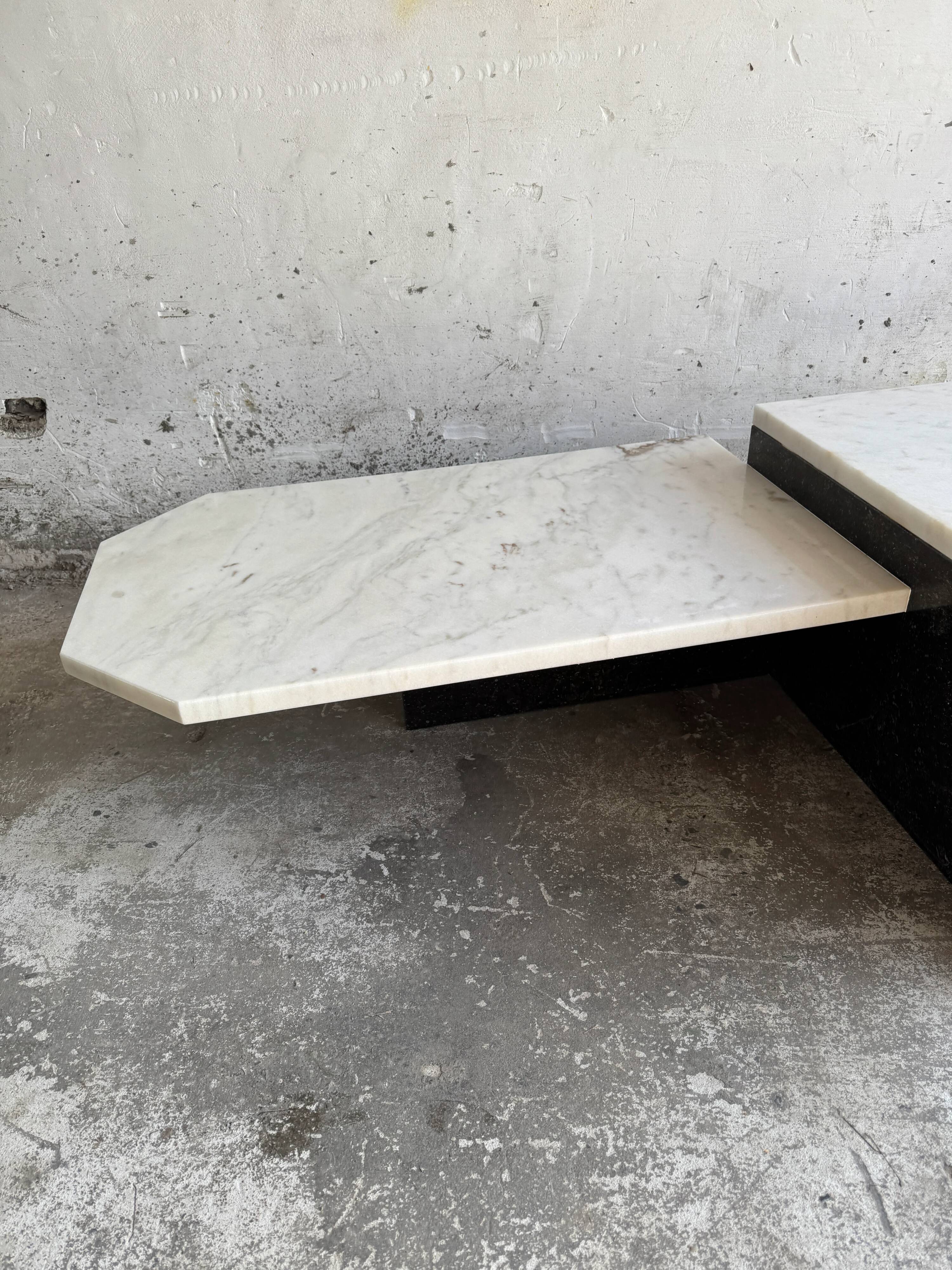 Postmodern white marble and black granite coffee table — sculptural asymmetrical design