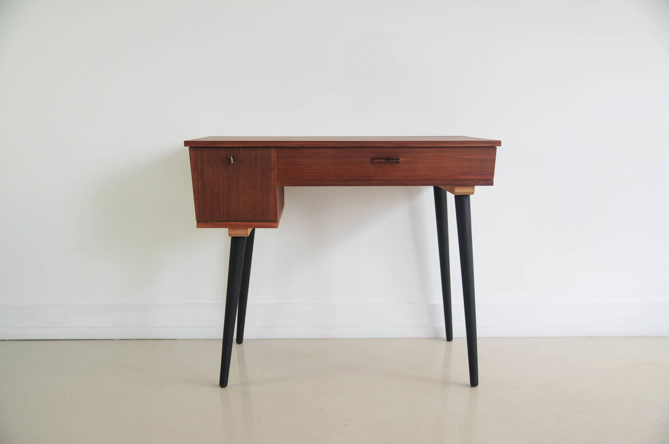 Vintage teak desk on black legs